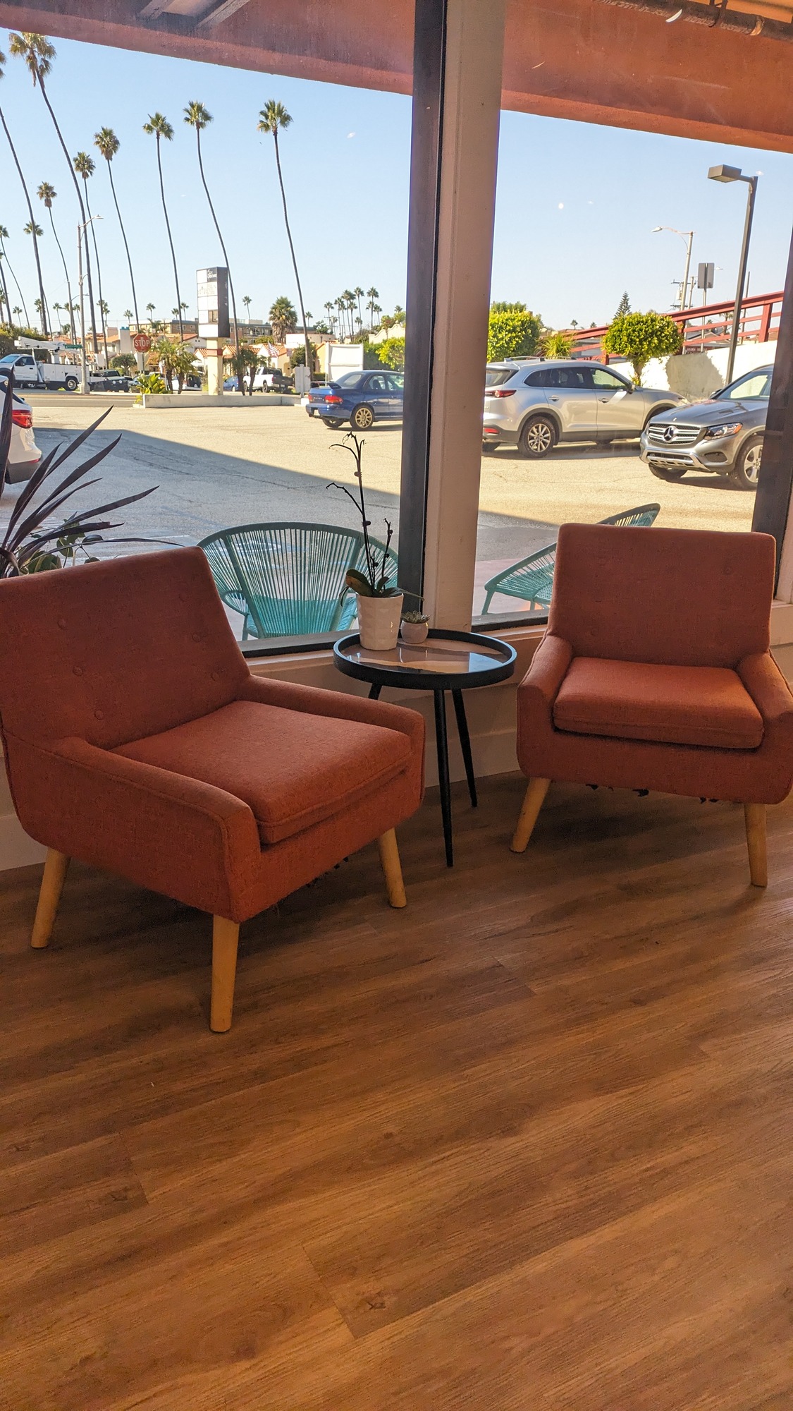 Lounge chairs by the window with a street view
