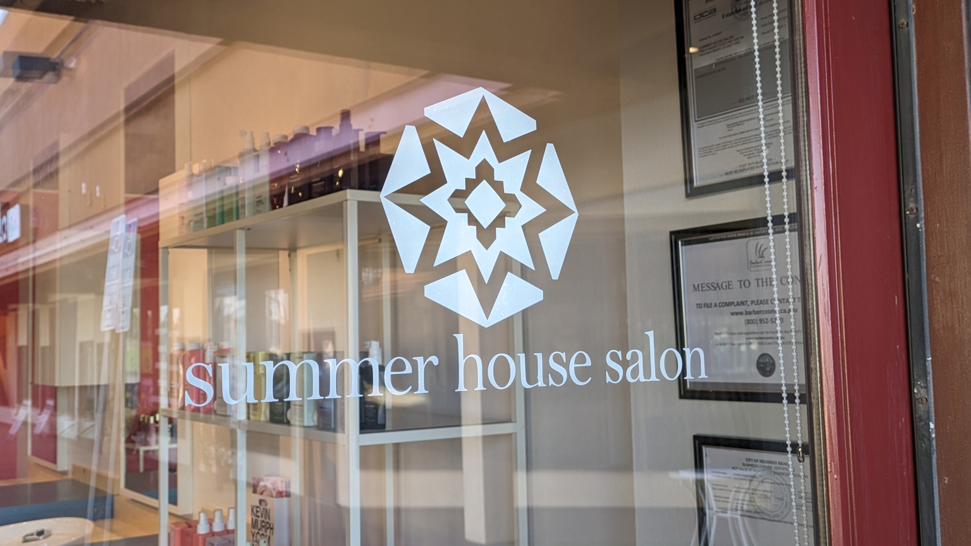 Summer House Salon storefront window with logo